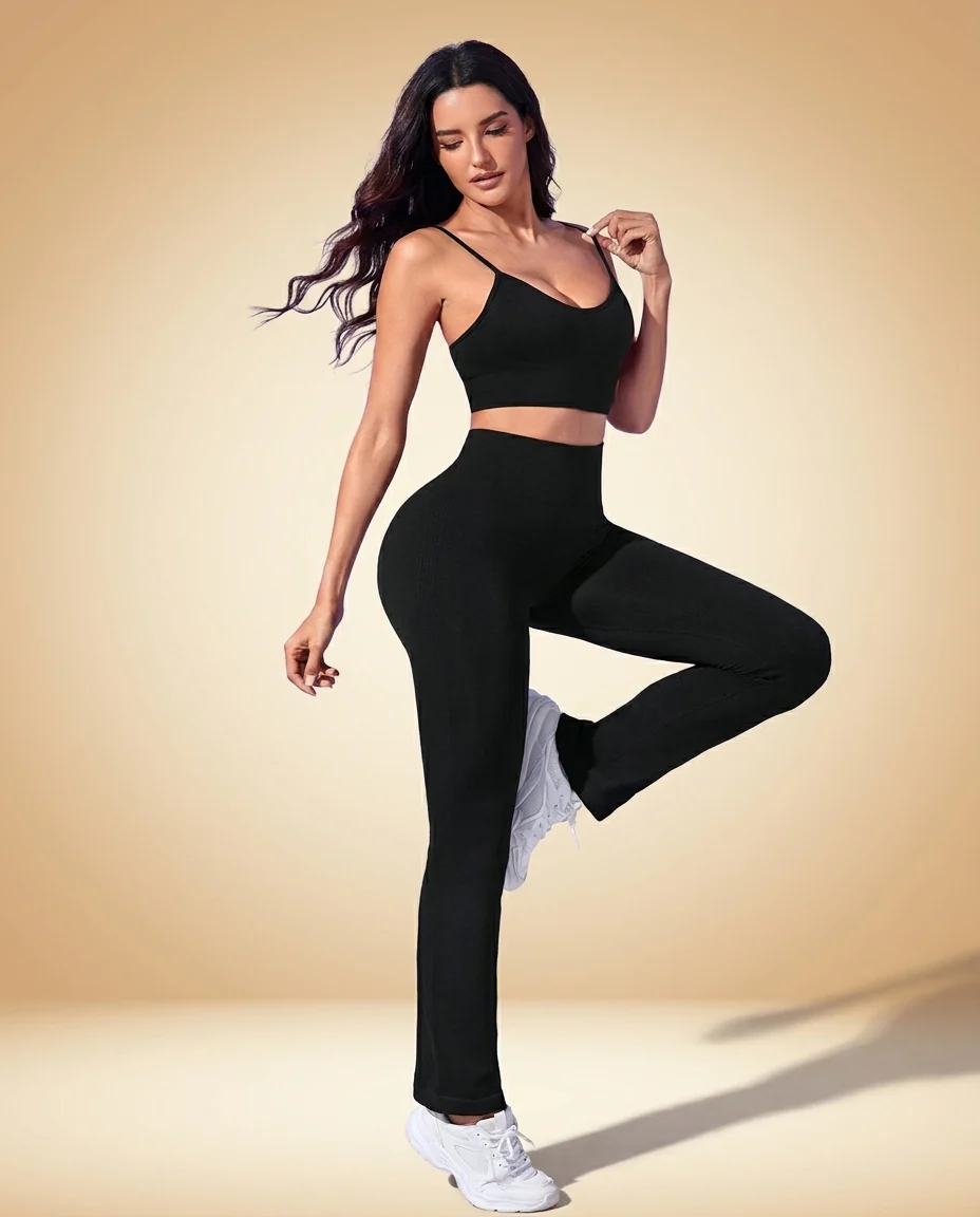 Walundi matching sets collection — black seamless crop top and bike shorts set on sand backdrop
